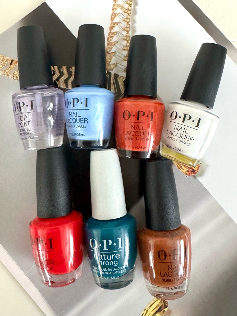 OPI Nail Polish Set of 7 — Red, Dark teal, Brown, 
Light Blue, Copper, White,